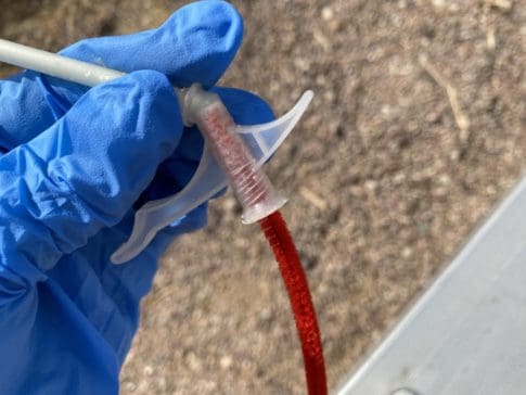 Cleaning foam filler dispensing nozzel with pipe cleaner