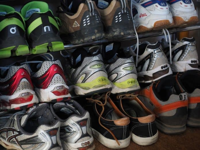 A shoe rack full of shoes