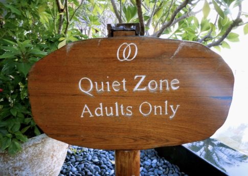 A wooden sign reads, "Quiet Zone. Adults Only."