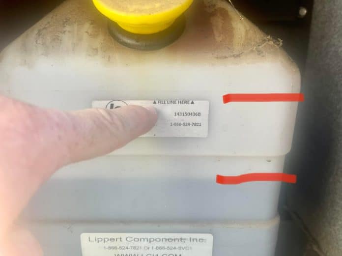 A line of liquid shows that the hydraulic leveling jacks are at too-low of levels