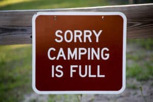A sign reads, "Sorry Camping Is Full."