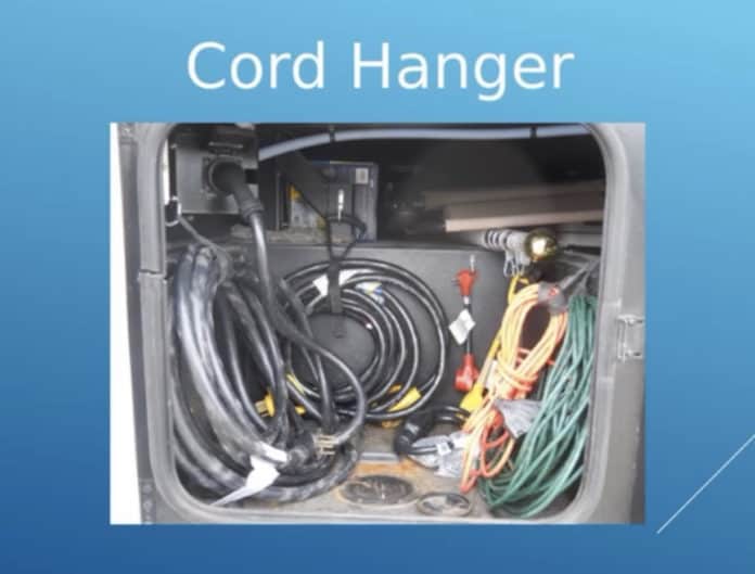 Using an inner tube cord hanger to organize cords