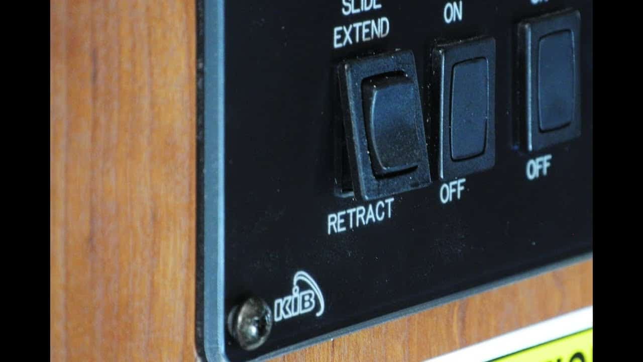 When do I release my RV slide-out button?