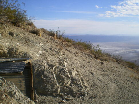 Mine opening high over valley 