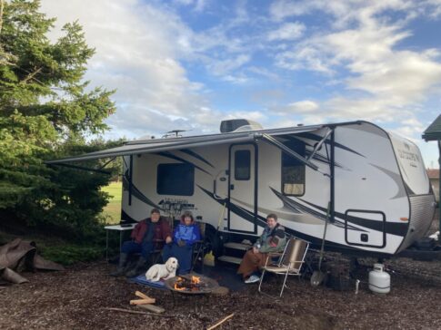 People by travel trailer 