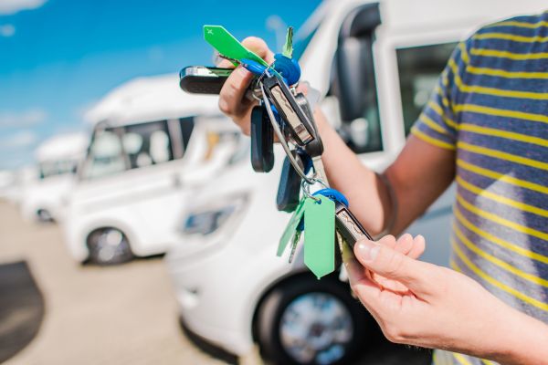 RV keys being handed off, title card of avoid RV dealers who do these things post
