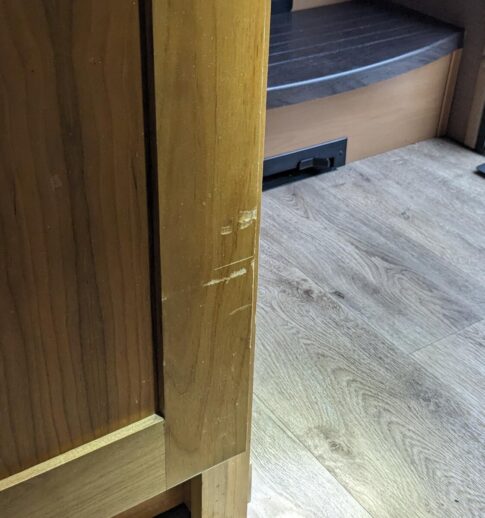 damage from cooler rubbing on RV cupboard