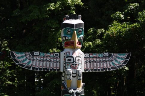 An eagle at the top of a totem pole