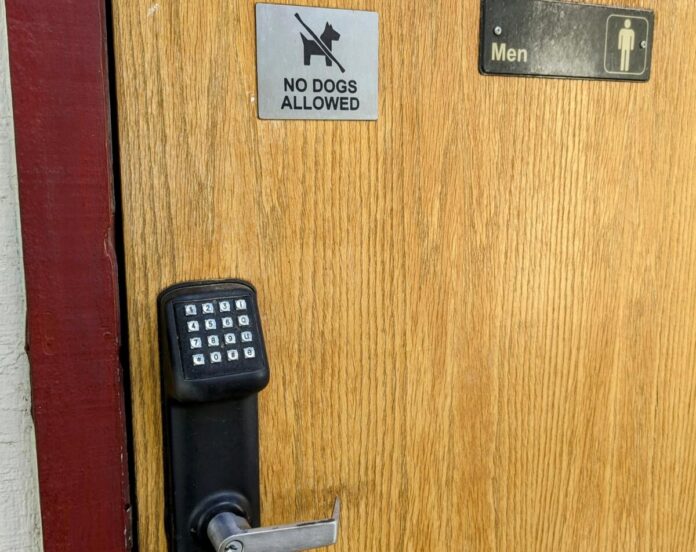 Mens locked/coded door to the campground's shower house/bathroom