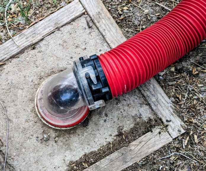 photo by Gail Marsh sewer hose with clear elbow connector