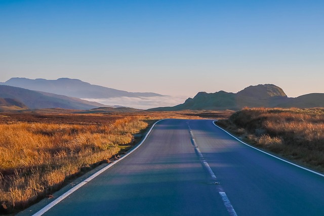 highway with mountains in background Pixabay