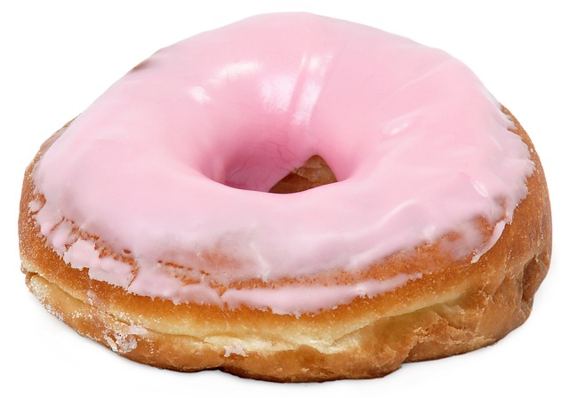 Pink frosted doughnut for National Doughnut Day. First Friday in June