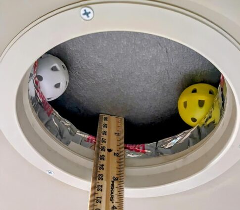 AC vent held open with practice golf balls Gail Marsh