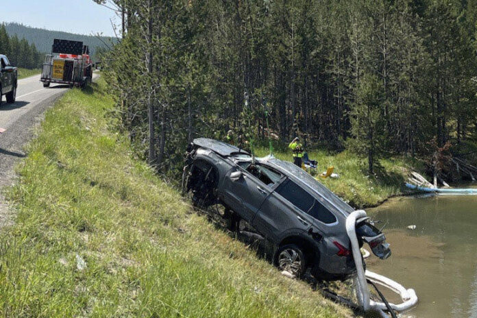 photo by NPS submerged SUV removed from geyser in Yellowstone NP