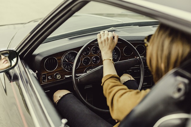 woman behind wheel of car for first learned to drive pixabay