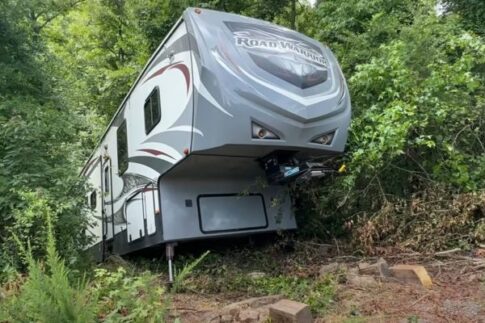 extreme off-rod recovery 5th wheel sliding down a hillside