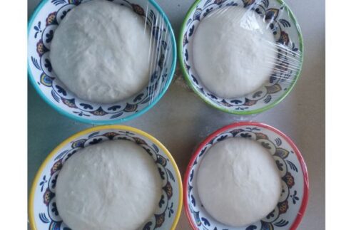 Cheri's Neapolitan pizza dough portions after rising and just before shaping and baking