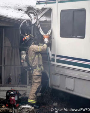 RV crashes into house