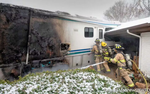 RV crashes into house