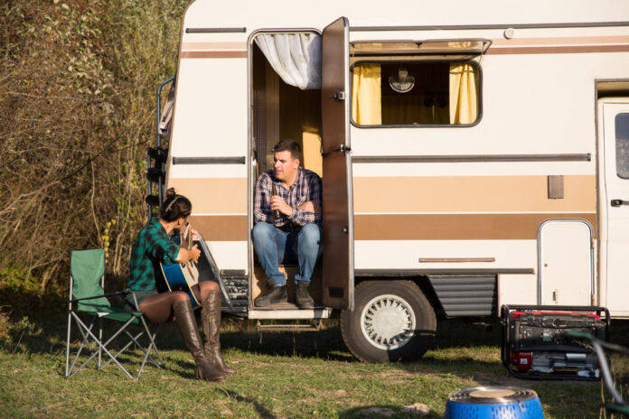 Parked RV with husband and wife at a free overnight RV spot