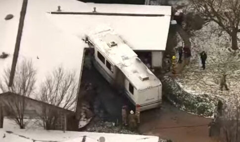 RV crashes into house