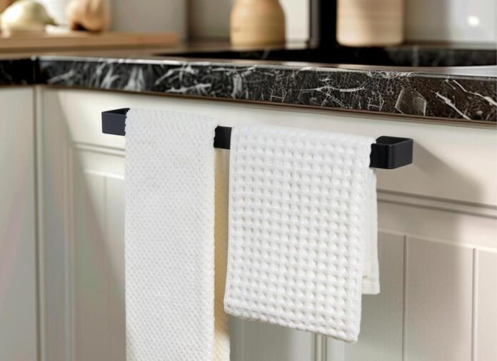A towel bar holds two towels for this article about towel bar hacks