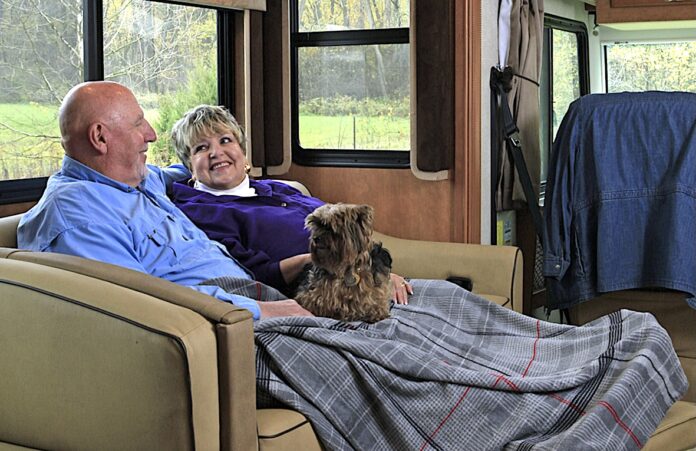 Older RVing couple relaxing in RV