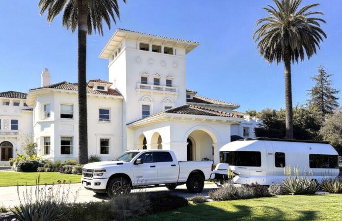 Skydream trailer in front of mansion