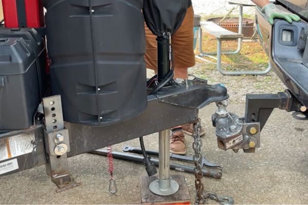trailer about to be hitched showing the difference between towing and payload weights